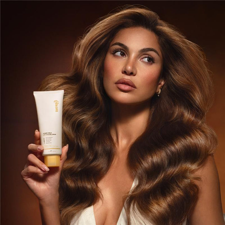 Negin Mirsalehi poses with Gisou's Styling Cream.