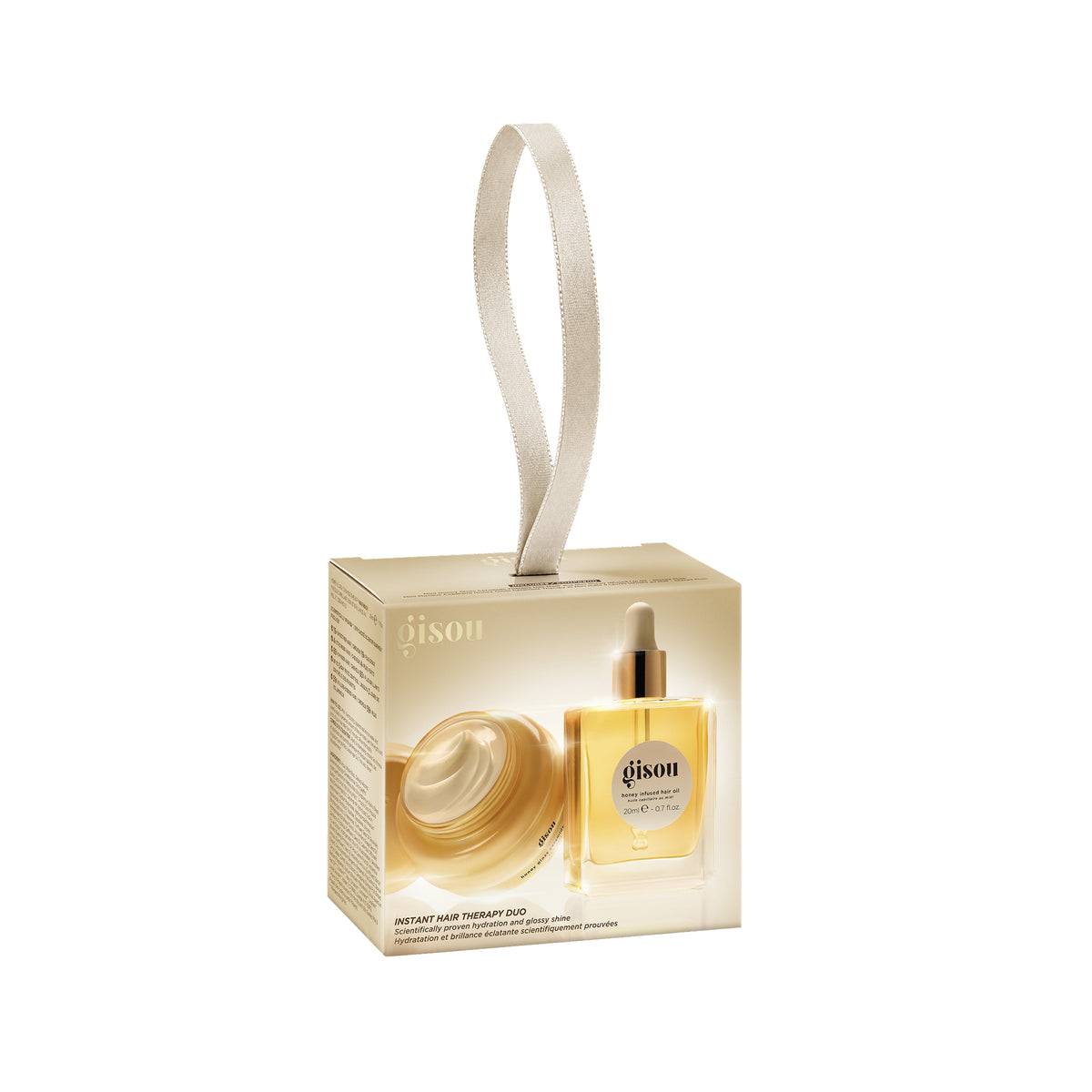 Gisou Instant Hair Therapy Duo holiday gift box with a ribbon loop, showing the mini hair mask and hair oil inside.