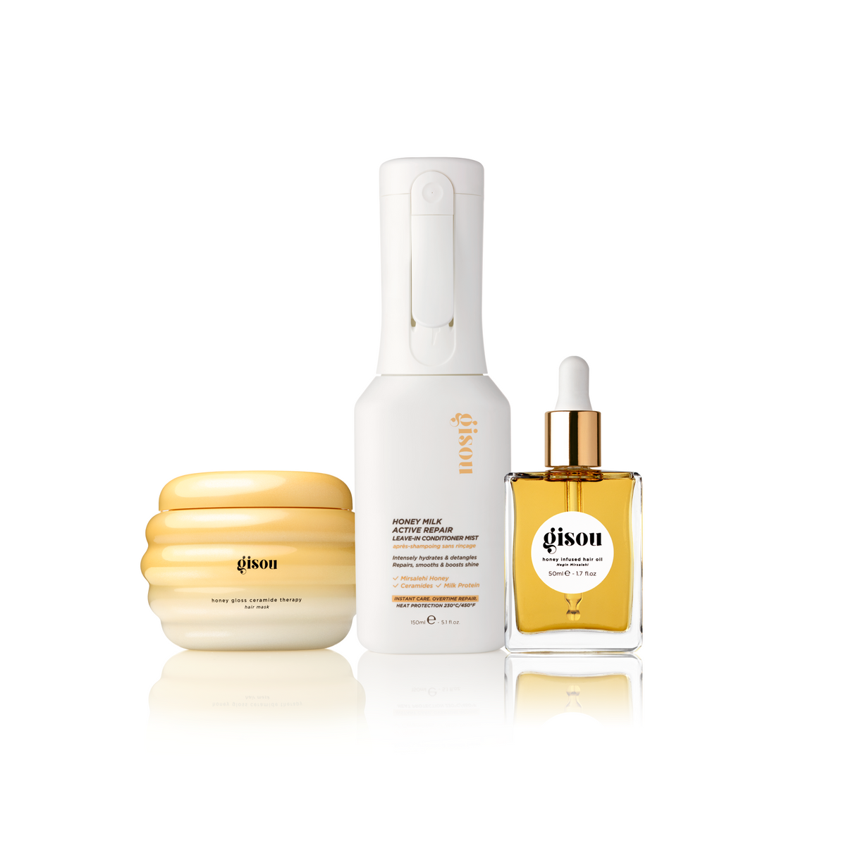 Gisou Honey Hydration Shine Trio: hair mask, leave-in conditioner mist and Honey Infused Hair Oil on a white background.