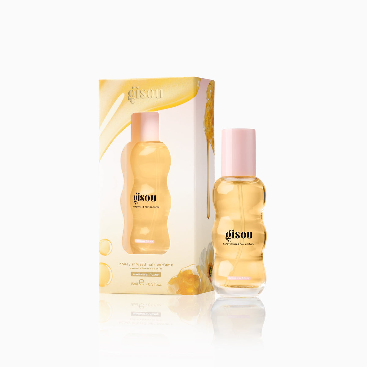 Mini  Wildflower Honey hair perfume bottle 0.5fl with its outer packaging on a white background.