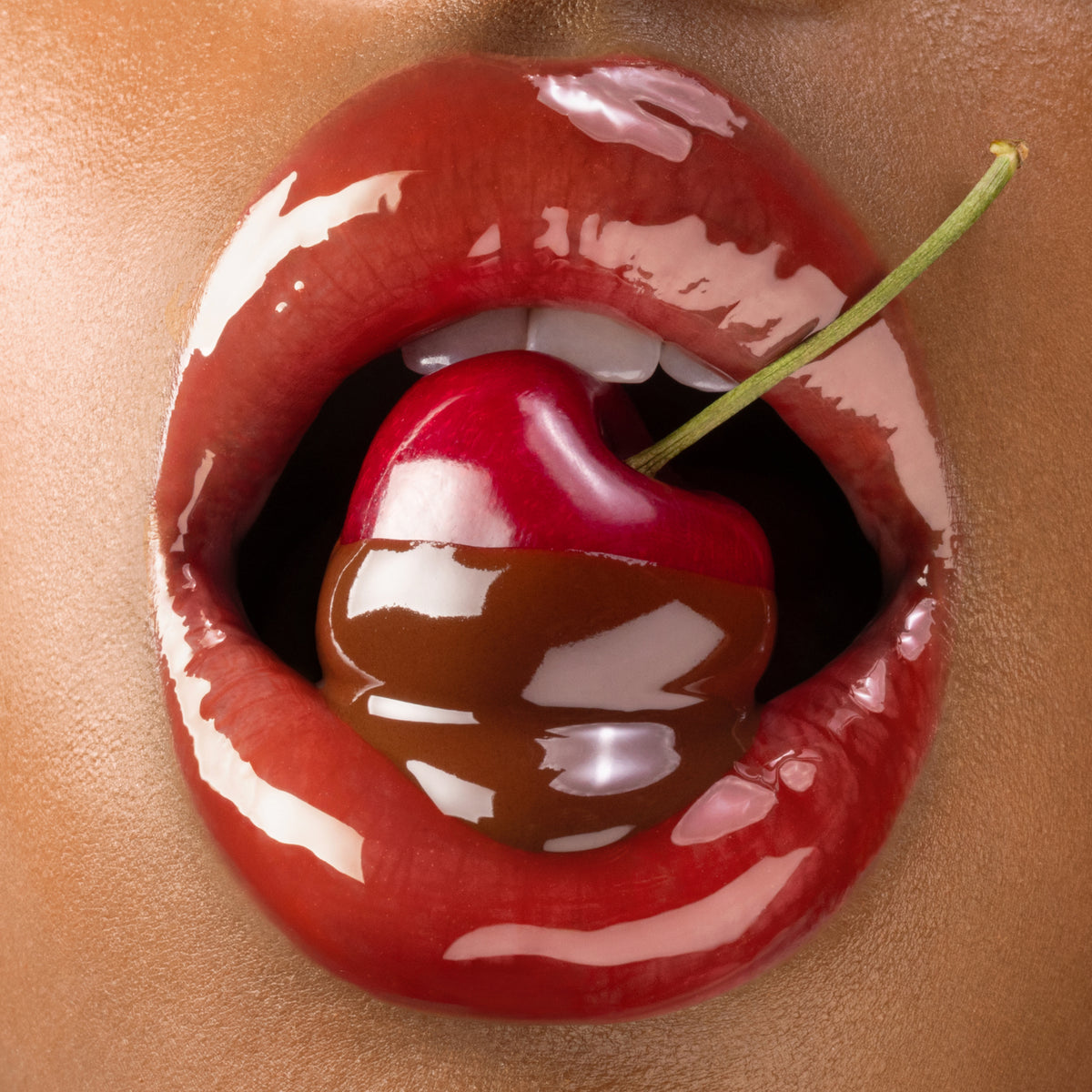 Close-up of glossy lips biting into a cherry stem, promoting the Gisou Cherry Chocolate Lip Oil.