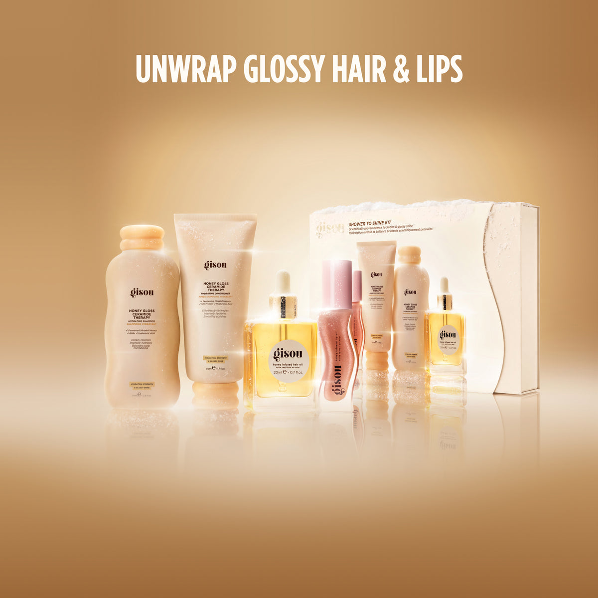 Gisou Shower to Shine Kit box, shampoo, conditioner, hair oil, and lip oil.