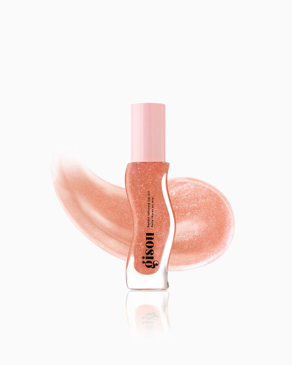 Plum shimmer lip oil including swatch. 