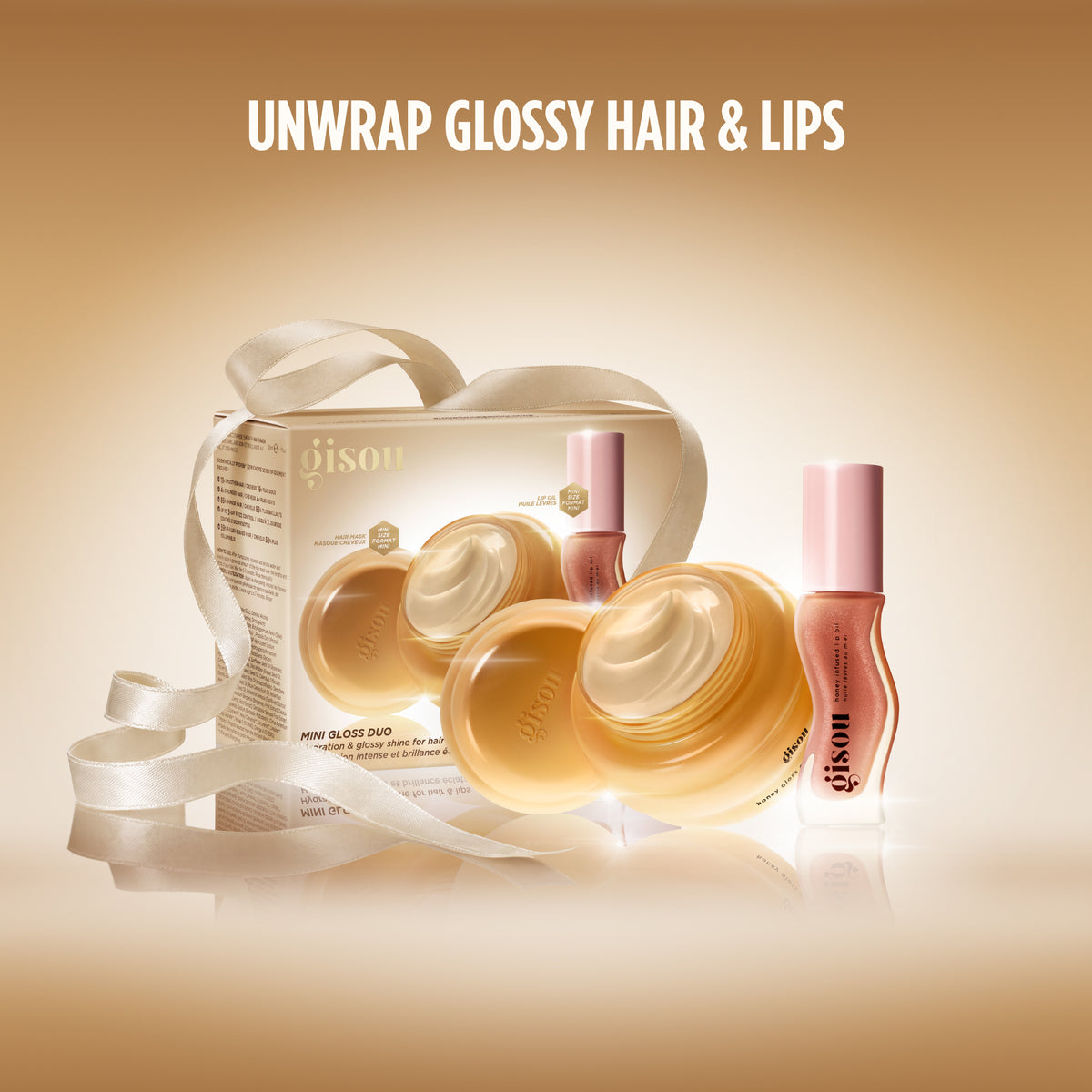 Gisou Mini Gloss Duo box with ribbon, hair mask, and lip oil, tagline 