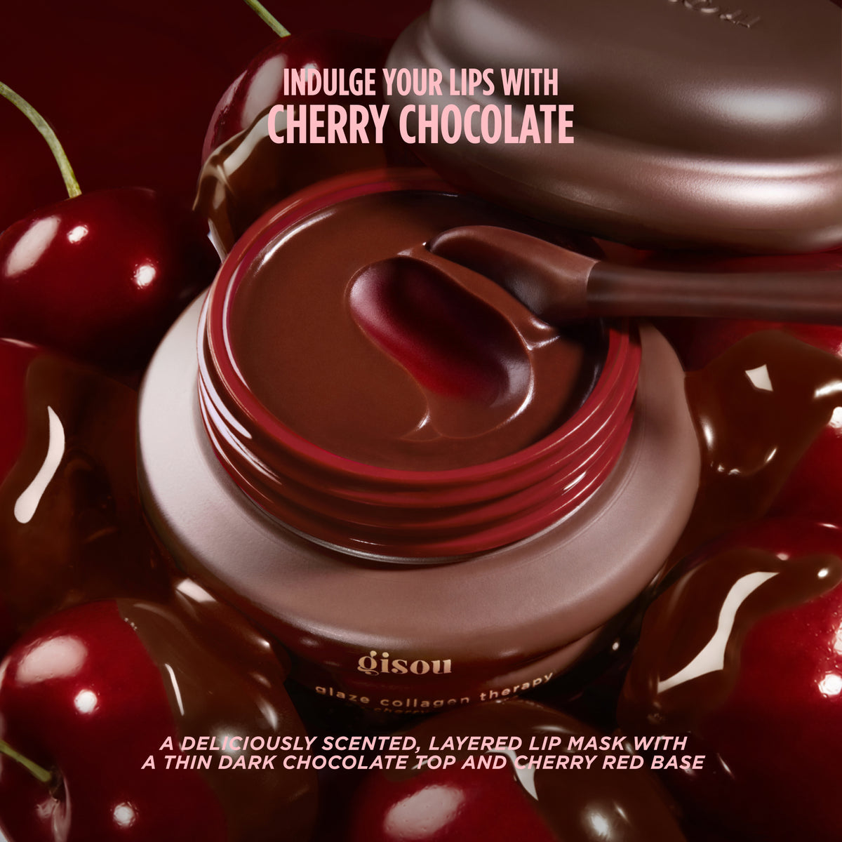 Gisou Lip Mask in Cherry Choco with a chocolate-dipped applicator, surrounded by cherries dipped in chocolate.