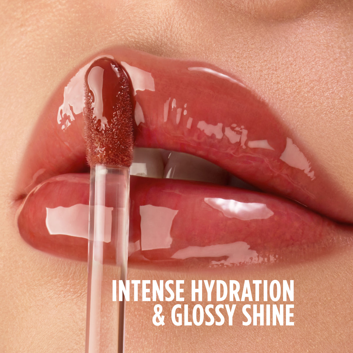 Close-up of a lip oil wand applying gloss to lips, labeled 