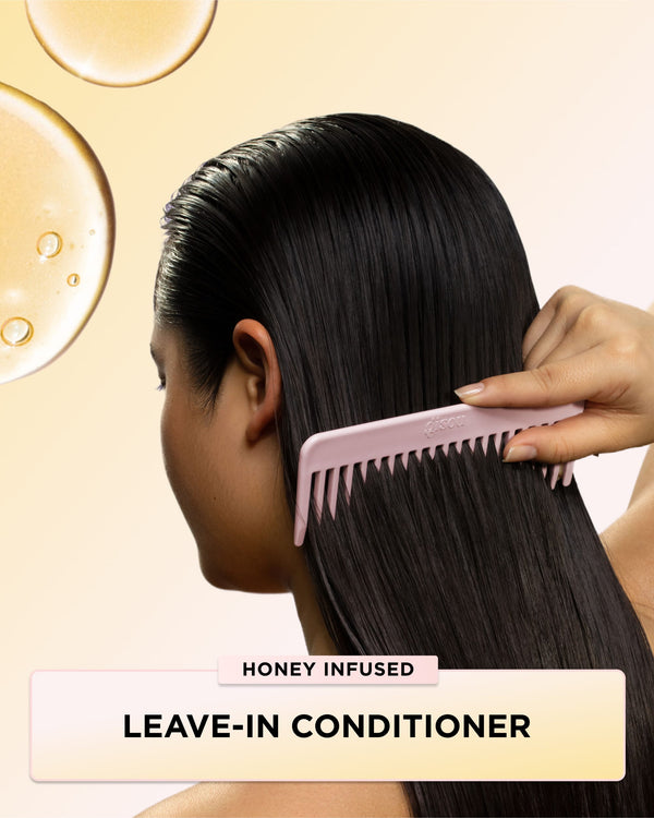 Model combing her hair after applying Honey Infused leave-in Conditioner