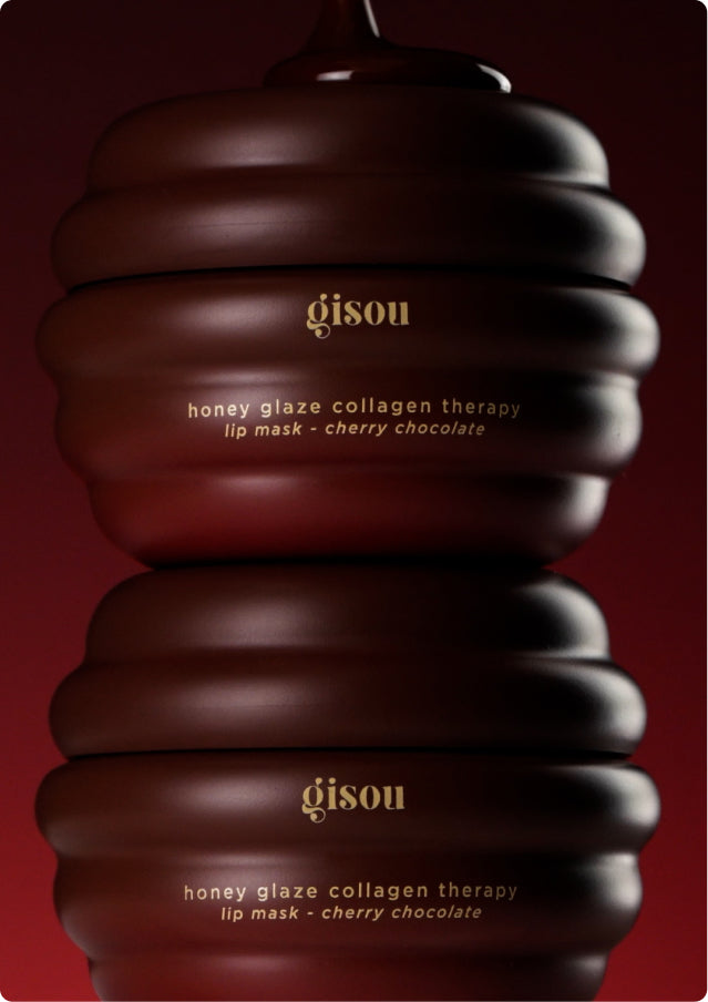 Stacked Gisou Cherry Chocolate Lip Mask jars dripping with chocolate