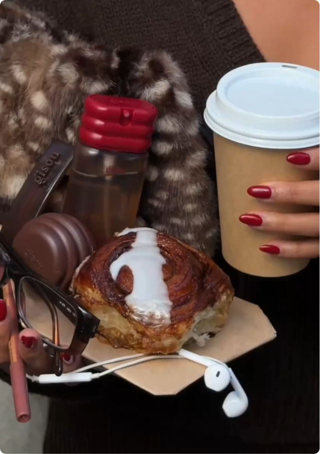 Gisou Honey Fluff Pouch with coffee, a cinnamon bun and Gisou lip products
