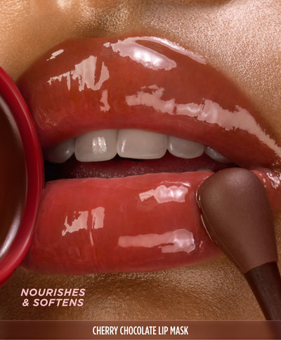 Close-up of a lip mask wand applying mask to lips, labeled 