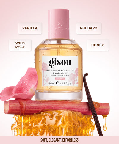 Wild Rose bottle with pink rose petals and ribbon, notes: rhubarb, wild rose & honey, vanilla.