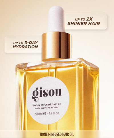 Gisou Honey Infused Hair Oil bottle, listing results: up to 2x shinier hair, 3-day anti-frizz and humidity control, 3-day hydration, and heat protection up to 230°C/450°F.