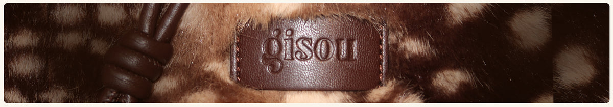 Fawn-print faux fur Gisou pouch with a knotted leather strap and embossed logo tag