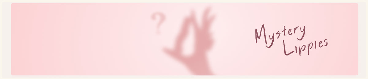 Mystery Lippies banner with a hand shadow and question mark on soft pink