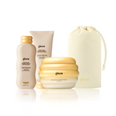 Gisou Honey Gloss Ceramide Therapy Hydrating Shampoo, Hydrating Conditioner, Hair Mask, and a Honey Glow Hair Towel pouch grouped together on white.