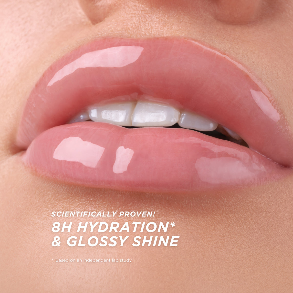 Close-up of lips wearing a soft, natural pink gloss with a high-shine, wet finish that reflects light like glass with scientifically proven 8-hour hydration and glossy finish.