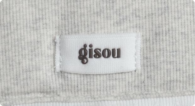 A close-up of Gisou label on a pouch.
