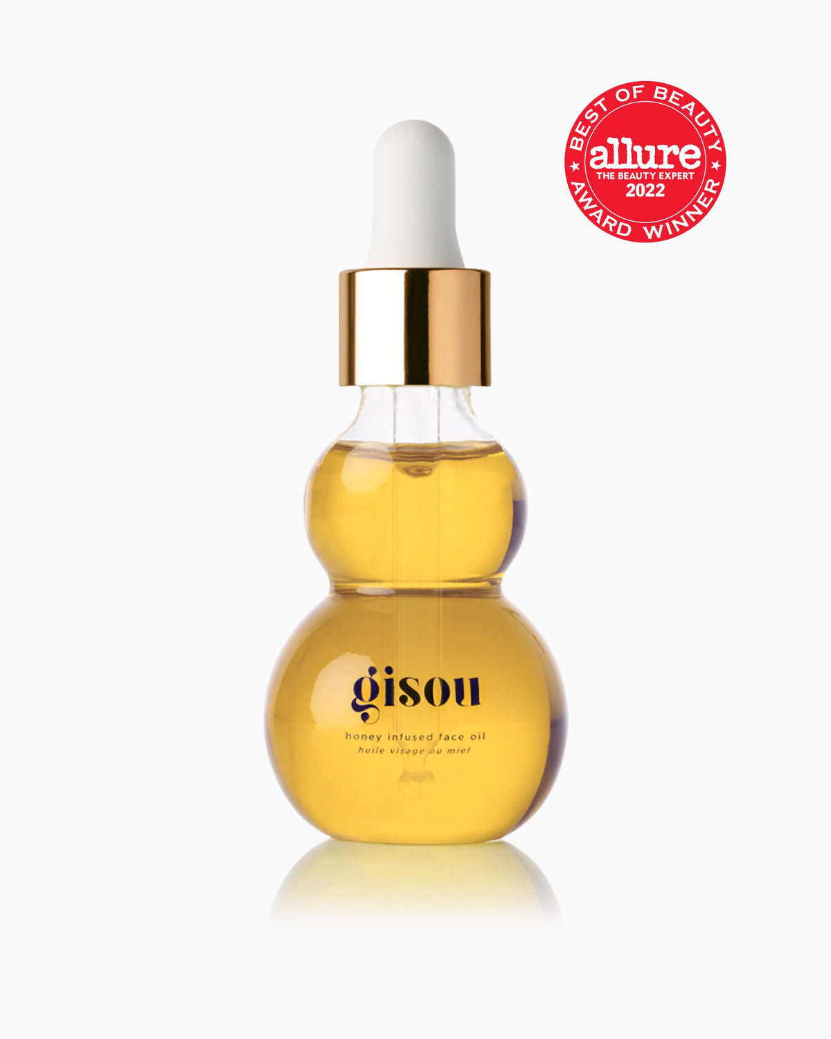 Bottles of the Honey Infused Face Oil suspended on air with flowers around