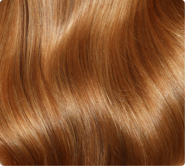 A close-up of glossy wavy hair.