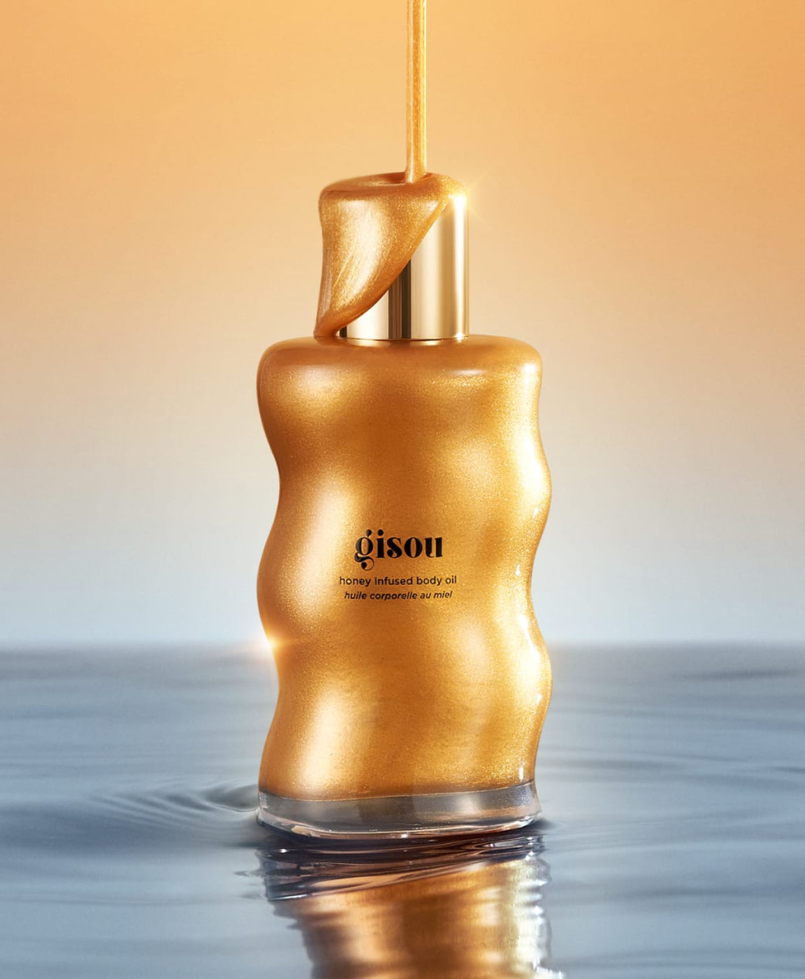 Body Oil Shimmer bottle with shimmer dripping on top