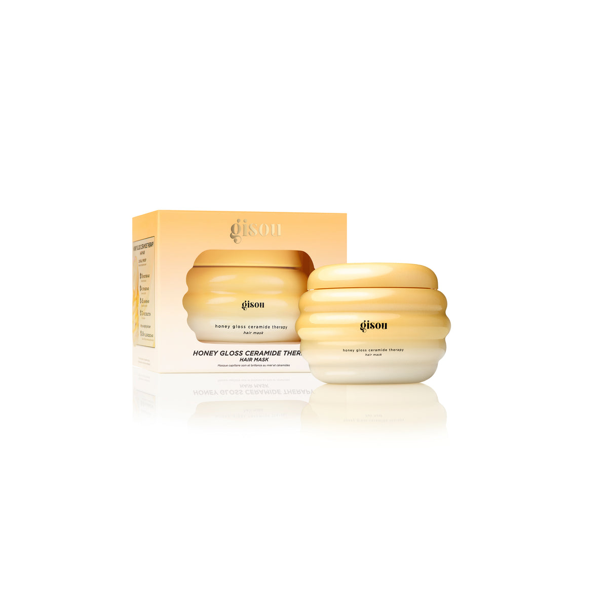 Gisou hair mask jar next to its matching box.