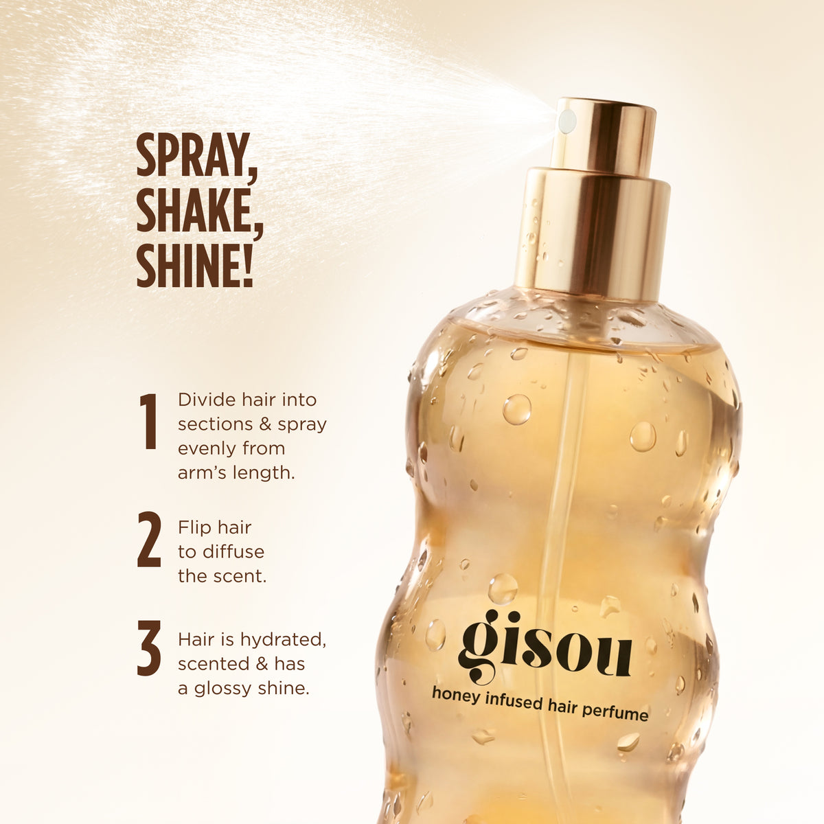 Close-up of the Gisou Honey Infused Hair Perfume bottle spraying a fine mist, with water droplets across the golden bottle and step-by-step instructions showing how to spray evenly through the hair for hydrated, scented hair with a glossy shine.