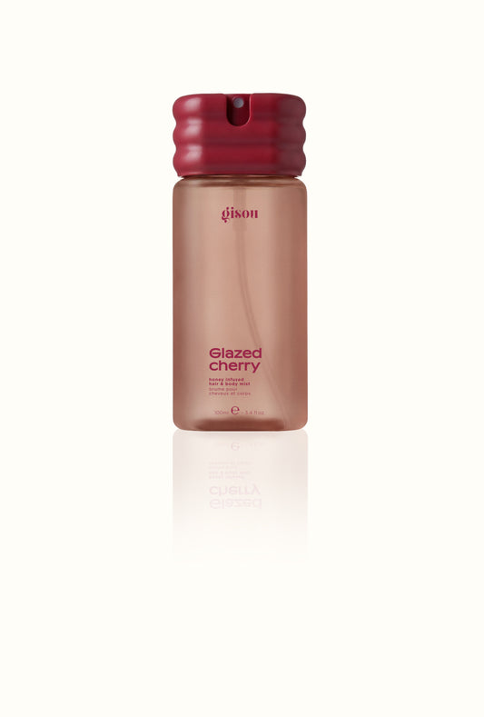 Honey Infused Hair & Body Mist bottle with a fine-mist sprayer, designed for both hair and body, in Gisou's signature golden honey-toned packaging.