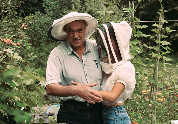 Negin and her father hugging in the Mirsalehi Bee Garden