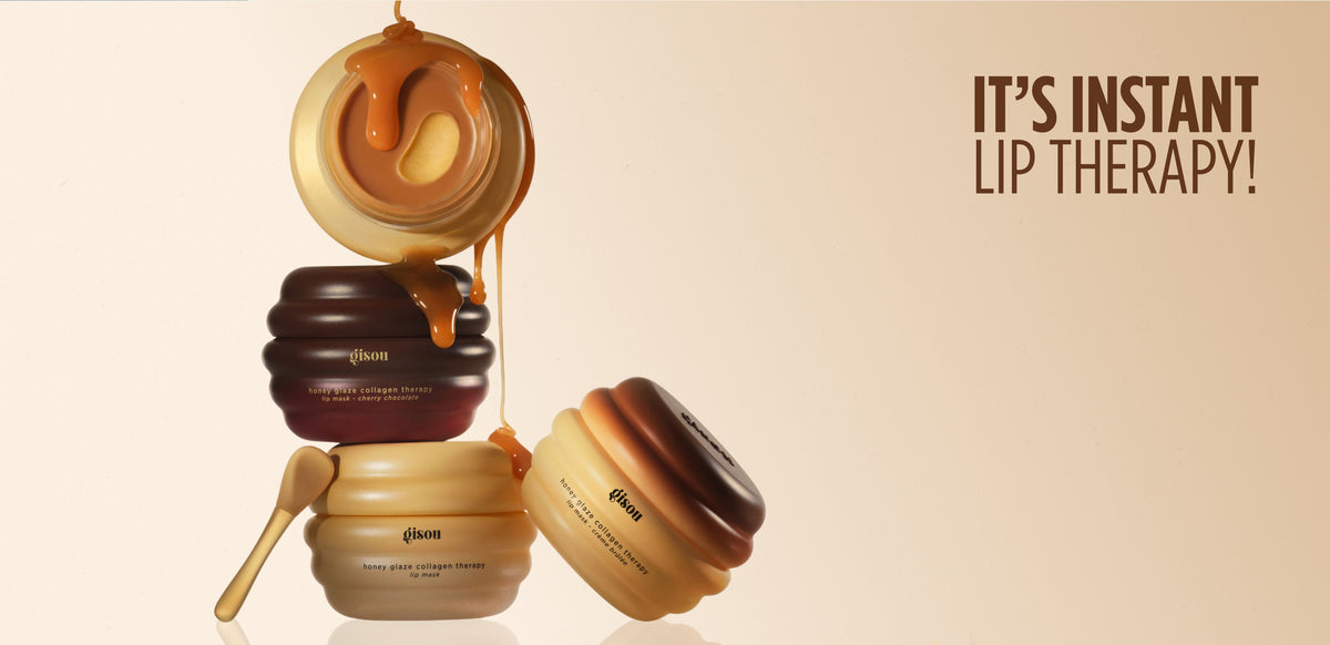 It's instant lip therapy! Stacked Gisou Lip Mask Trio jars with honey dripping