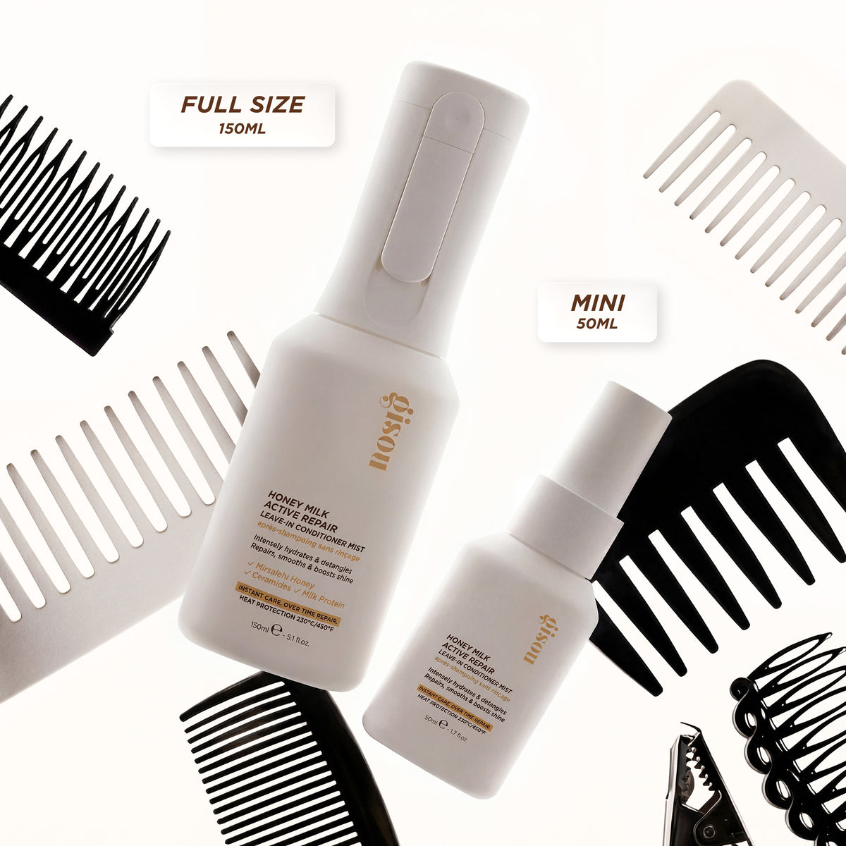 Gisou Honey Milk Active Repair Leave-In Conditioner Mist full-size and mini bottles surrounded by hair combs.