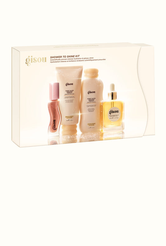 Gisou Shower to Shine Kit holiday gift box, showing the mini shampoo, conditioner, hair oil, and lip oil inside.