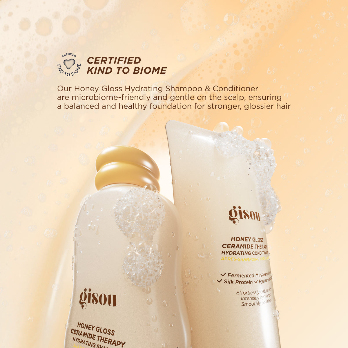Gisou Honey Gloss Ceramide Therapy Hydrating Shampoo and Conditioner with foam, highlighting microbiome-friendly formula and “Certified Kind to Biome” claim for balanced, healthy scalp and glossy hair.