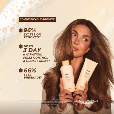 Negin Mirsalehi, founder of Gisou, holding Honey Gloss Ceramide Therapy Shampoo and Conditioner, showcasing smooth, glossy hair with scientifically proven results on hydration, breakage reduction, and oil removal.