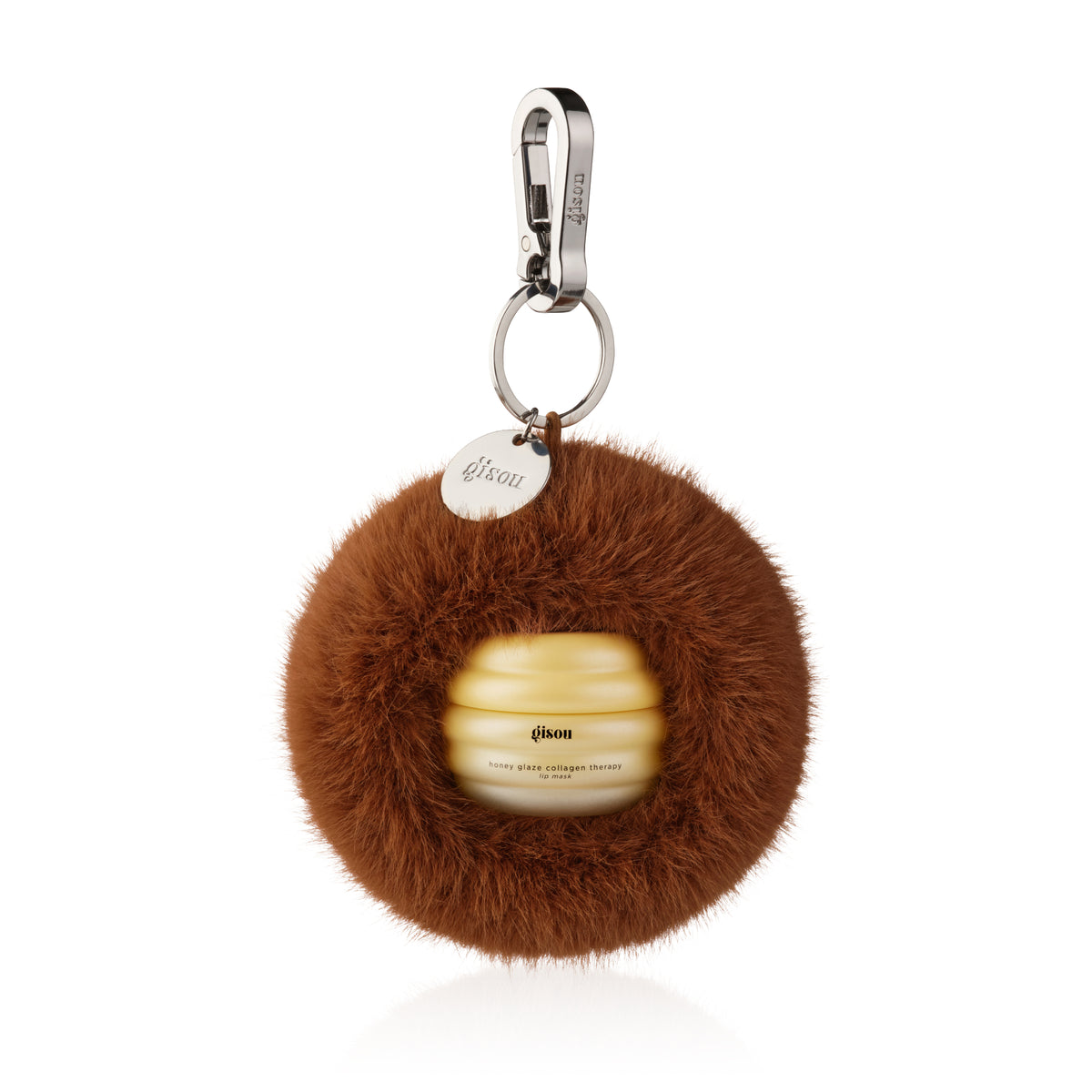 Toffee Honey Fluff: brown faux fur keychain holding a Gisou lip mask