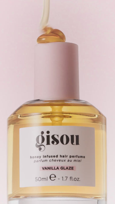 Gisou Honey Infused Hair Perfume Vanilla Glaze surrounded by textures of vanilla cake, frosting and honey.