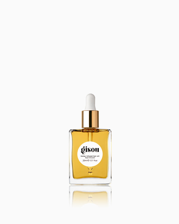 A bottle of Honey Infused Hair Oil Mini